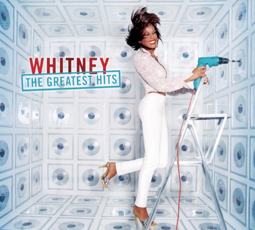 Whitney Houston album cover: she’s on a ladder with a drill.