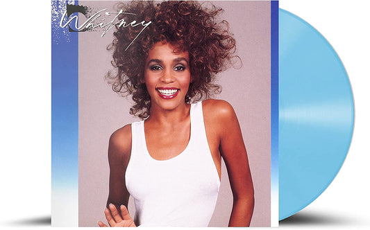 Whitney Houston album cover with a blue vinyl record disc next to it.