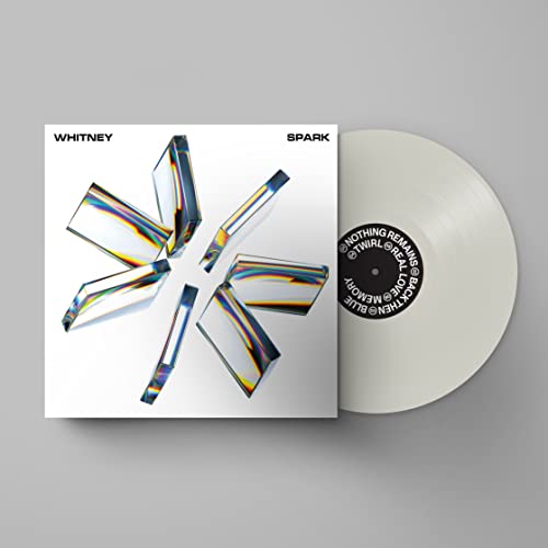 Whitney’s “Spark” vinyl record, white disc and cover with abstract design.
