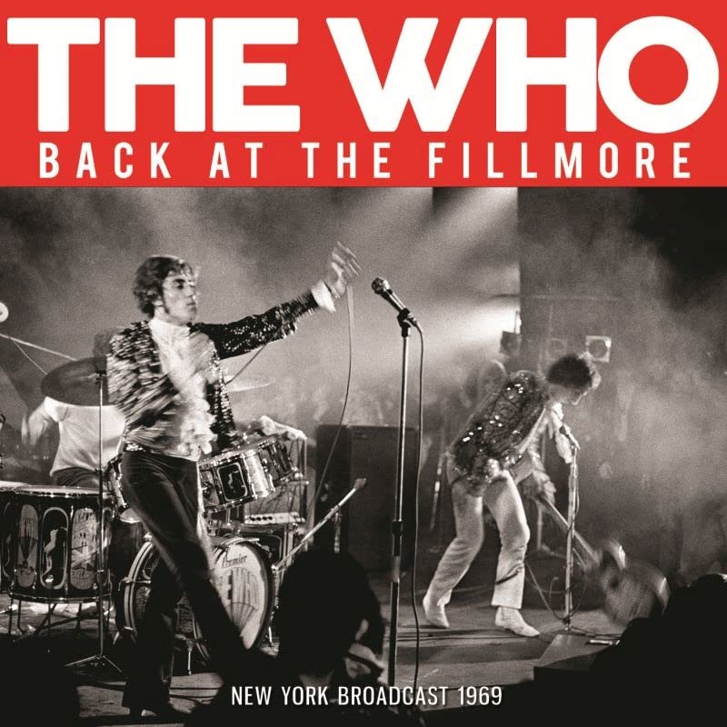The Who performing live on stage in black and white, 1969.
