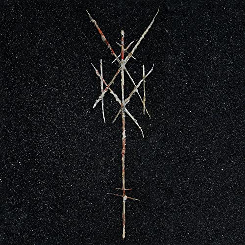 A symbol made of thin, blood-stained sticks centered on a black, grainy background.