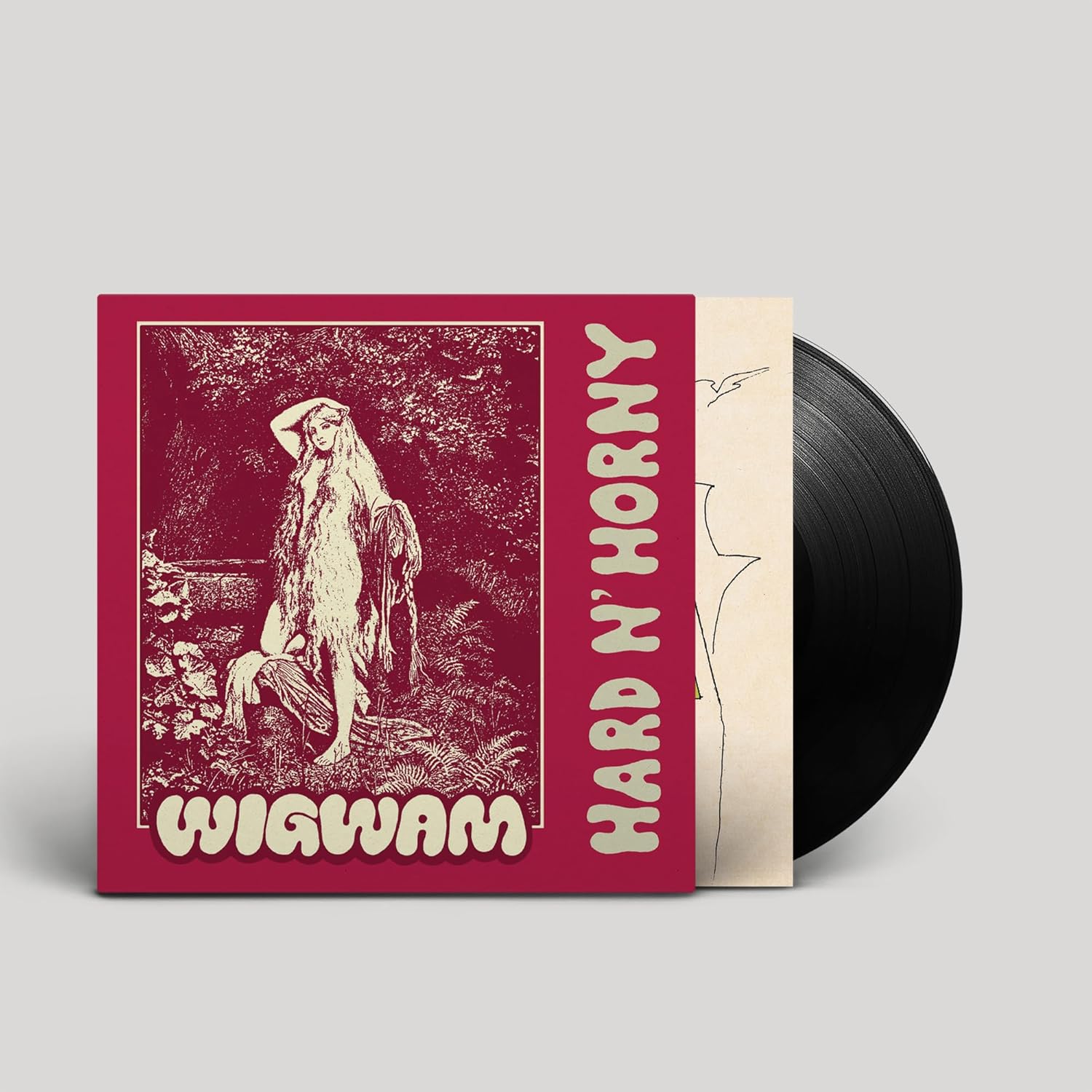 Vinyl record and album cover featuring a long-haired figure in a forest.