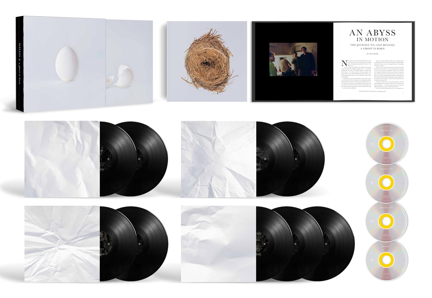 Wilco A Ghost Is Born vinyl box set with records, CDs, and illustrated book.
