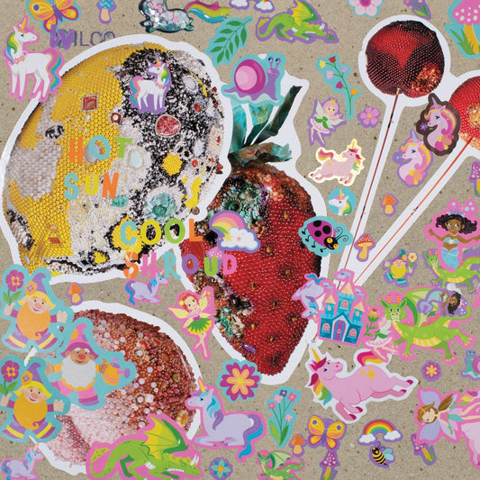 Wilco "Hot Sun Cool Shroud" CD cover with colorful collage imagery.