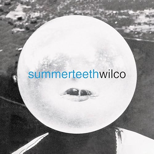 Black and white album cover featuring a large glowing orb with visible lips.