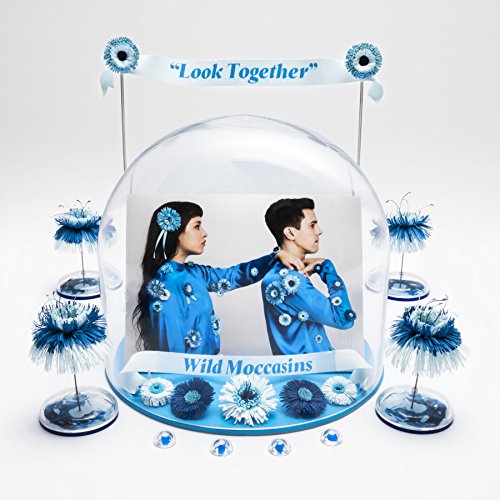 "CD cover with two people in blue outfits, surrounded by blue flowers and decorations."