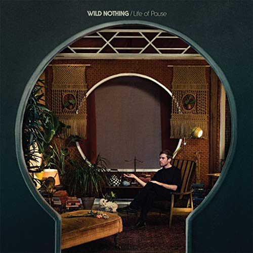 Album cover: man seated in a room viewed through an archway.