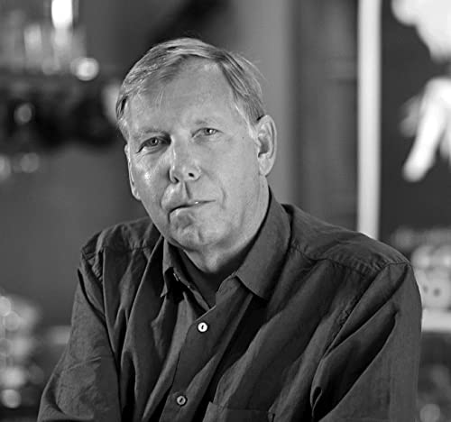 Black and white portrait of a middle-aged man with short hair.