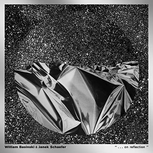 Black and silver abstract album cover with crumpled metallic foil.