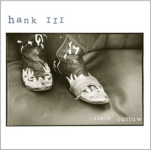 Black and white album cover featuring worn cowboy boots and denim.