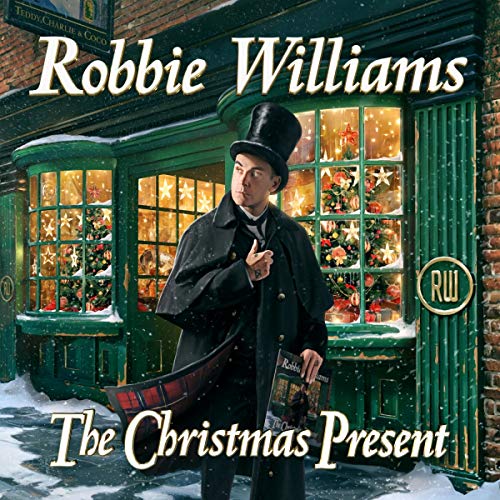 Robbie Williams in Victorian attire stands before a decorated shop window.