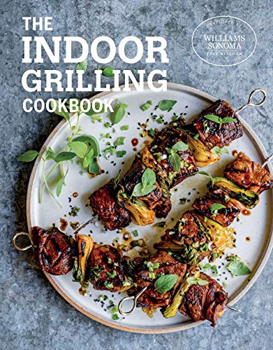 Cookbook cover featuring grilled meat skewers on a speckled plate.