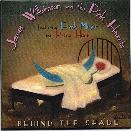 Album cover: bed with blue shapes, a rose, and text details.