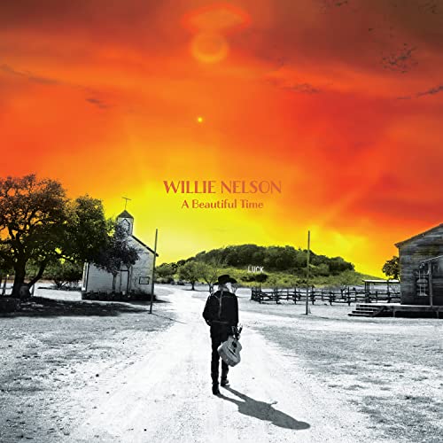 Willie Nelson album cover: man walking toward a church in a sunset.