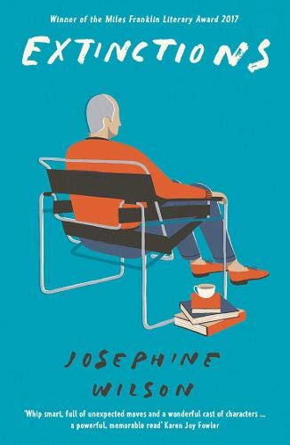 Book cover: man in red sits with books and a teacup.
