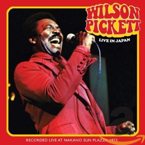 Wilson Pickett singing into a microphone on a red album cover.
