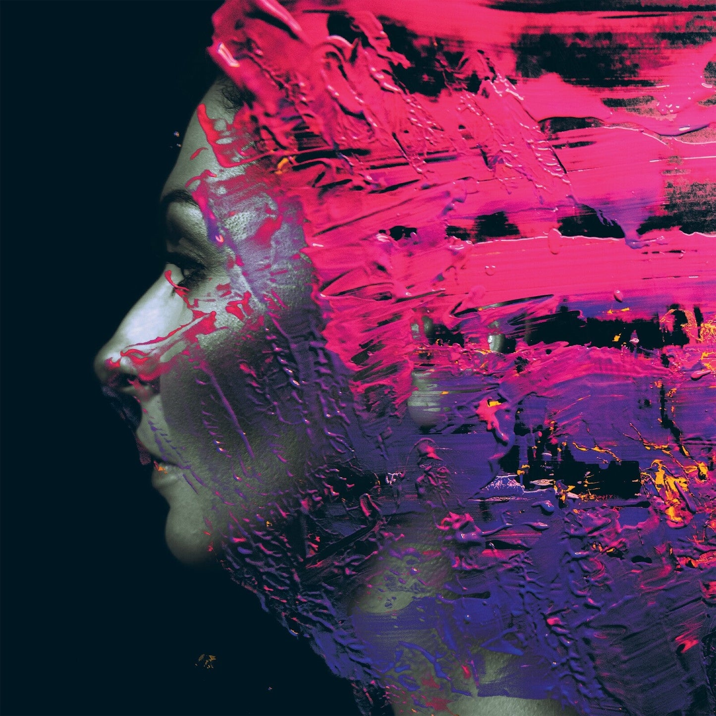 Profile of a face partially obscured by vibrant pink and purple paint strokes.