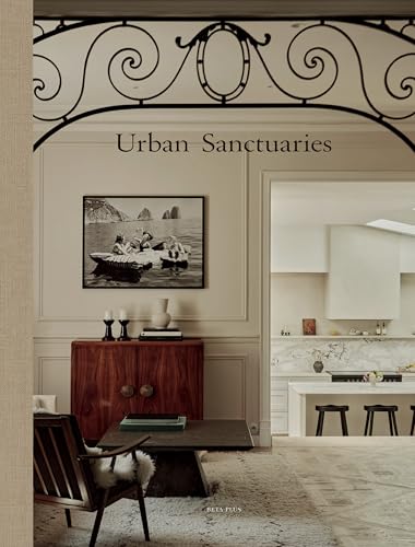 Book "Urban Sanctuaries" displayed with interior decor, artwork, and furniture.