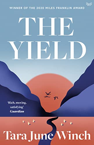 Book cover for The Yield by Tara June Winch featuring a sunset landscape.