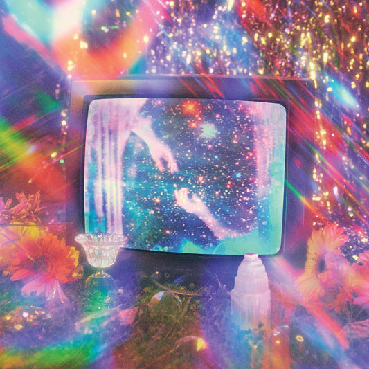 Retro television displaying a starry, colorful nebula with surrounding flowers.