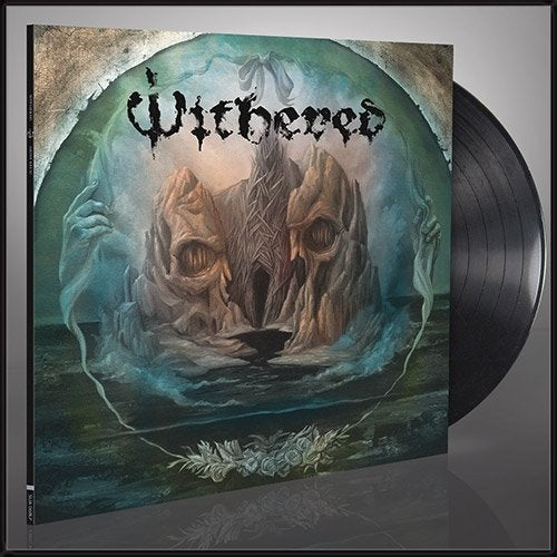 Dark album cover with skull-shaped mountains and ghostly hands.