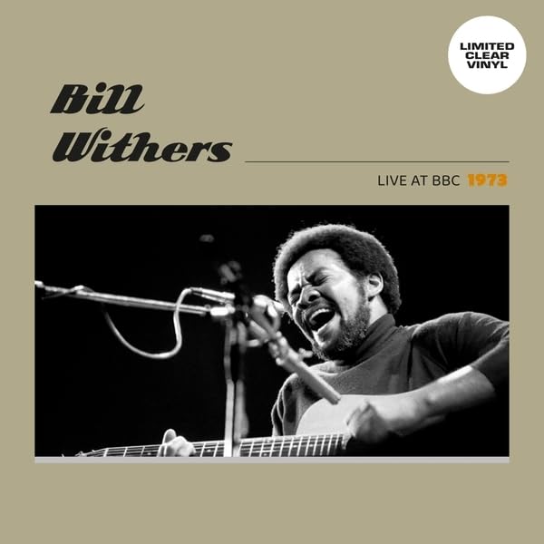 Bill Withers performing live with a guitar, album cover art.