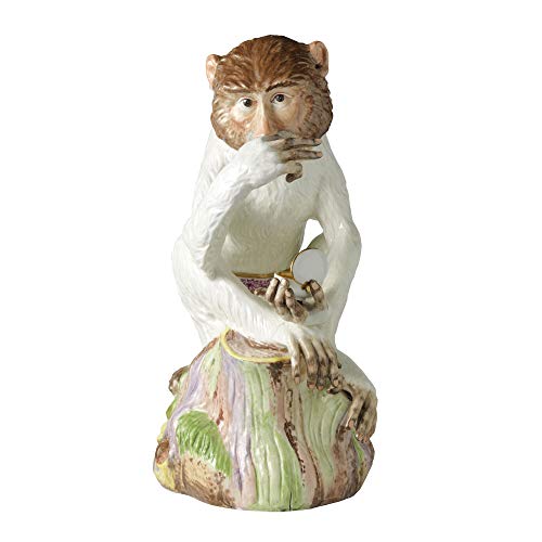 Ceramic monkey figurine thoughtfully holding a small, round mirror.