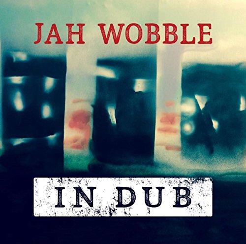"Album cover with 'Jah Wobble In Dub' text, abstract, blurry background."
