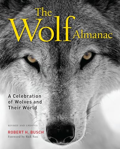 Close-up book cover featuring a gray wolf’s face and title “The Wolf Almanac.”