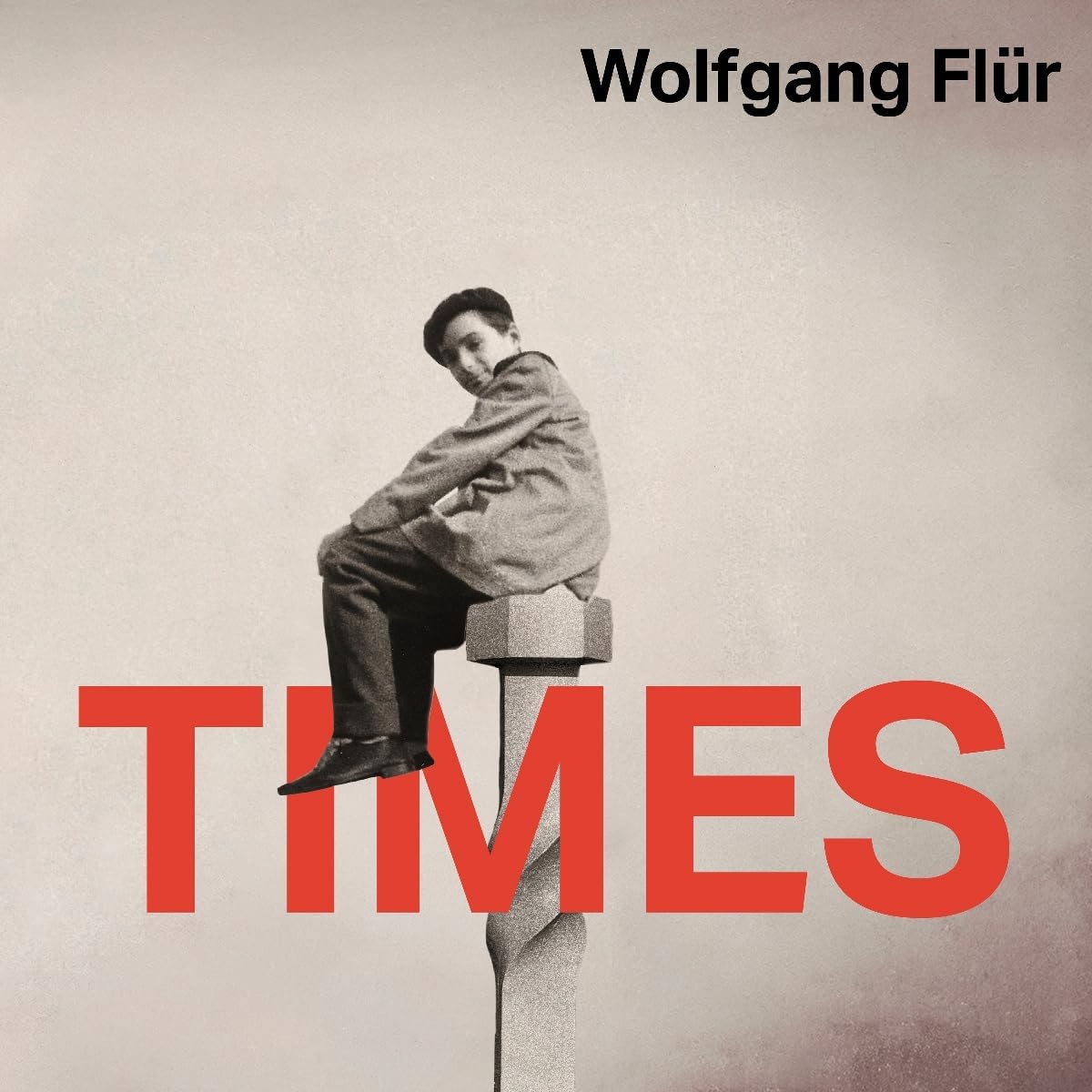 Album cover featuring a person sitting on a post with the text Wolfgang Flür Times.