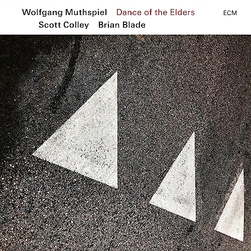 CD cover: asphalt with white painted triangles, text at top.