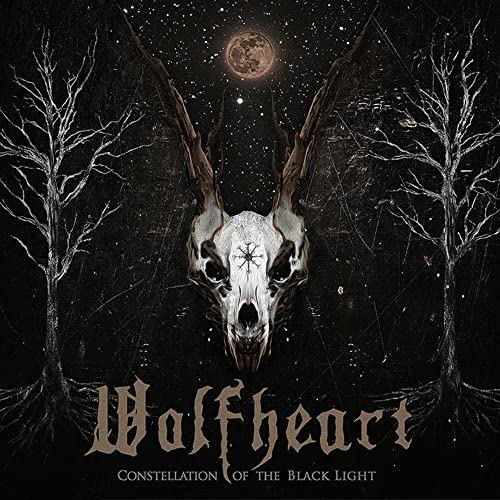 A skull with large antlers sits between two bare trees under a night sky.