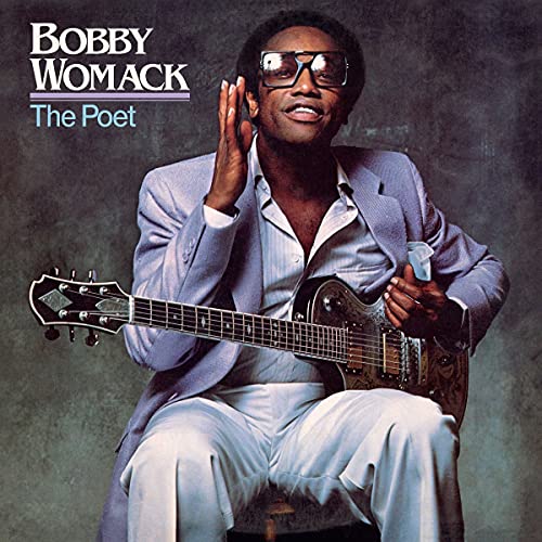 Bobby Womack portrait on album cover, holding a guitar, wearing sunglasses.