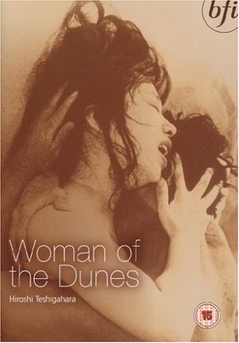 DVD cover for "Woman of the Dunes" featuring a woman’s face and hands.