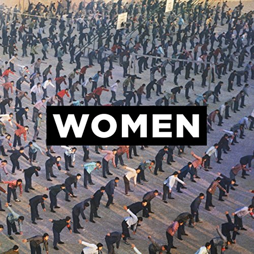 Aerial view of men in suits, with "WOMEN" text overlay on a black rectangle.