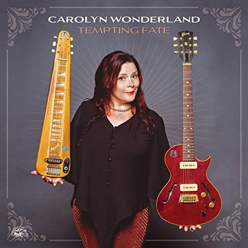 Carolyn Wonderland album cover, holding a pedal steel and electric guitar.