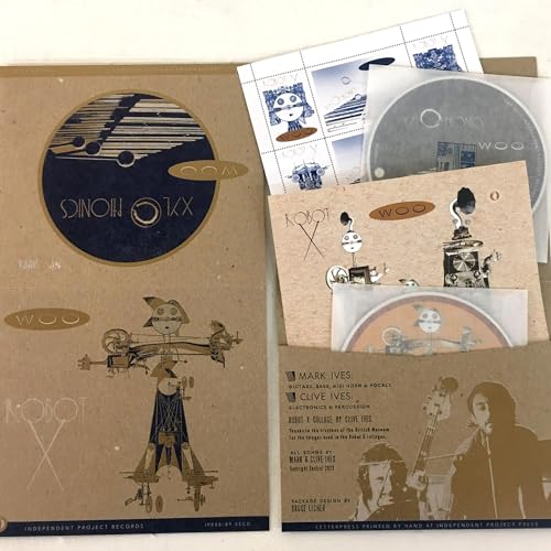 CD packaging for "Woo - Xylophonics + Robot X" with robot and musical imagery.