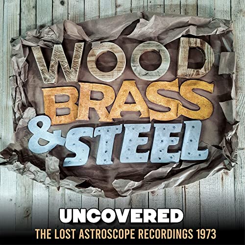 Vinyl album cover for "Wood Brass & Steel - Uncovered" with rustic lettering.