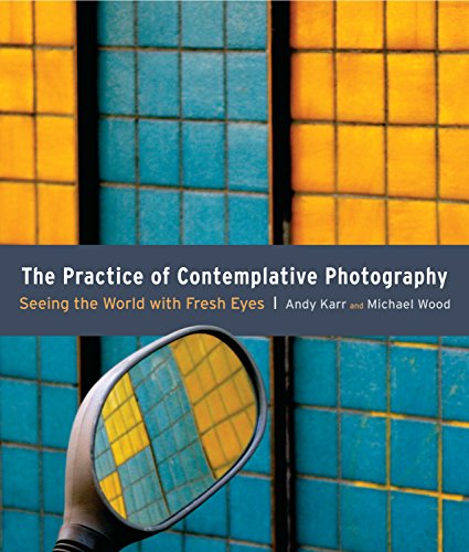 Book cover with blue and orange tiled wall reflected in a mirror.