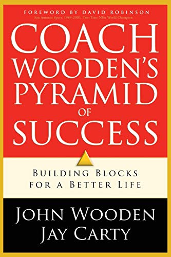 Book cover: "Coach Wooden's Pyramid of Success" with a yellow triangle.
