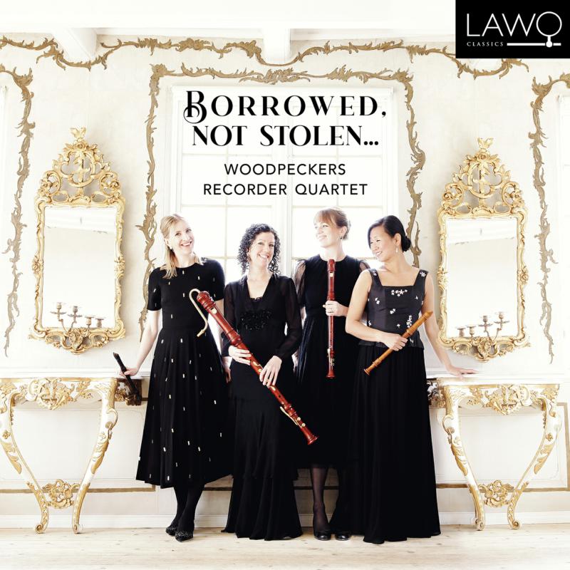 Four women with recorders stand before ornate gold-framed mirrors.
