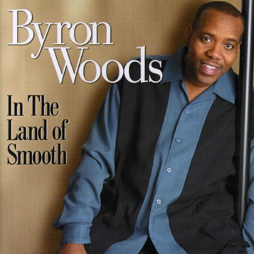 CD cover featuring portrait of Byron Woods, smiling and wearing blue.