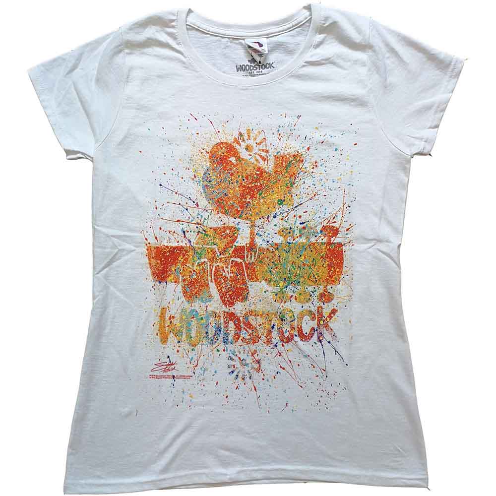 Woman wearing a white t-shirt with a colorful Woodstock logo print.