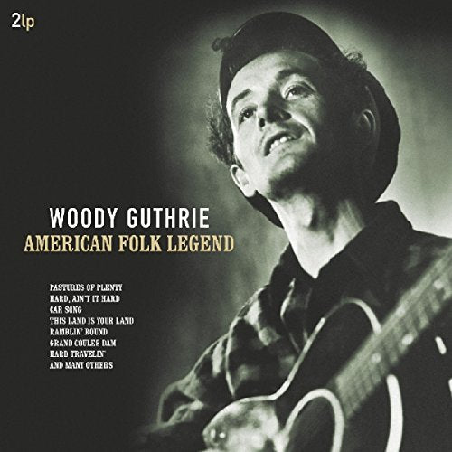Woody Guthrie portrait on a double LP record cover, guitar visible.