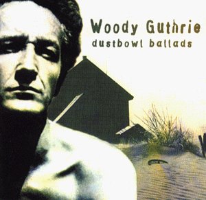 Woody Guthrie album cover with a portrait and rural buildings.