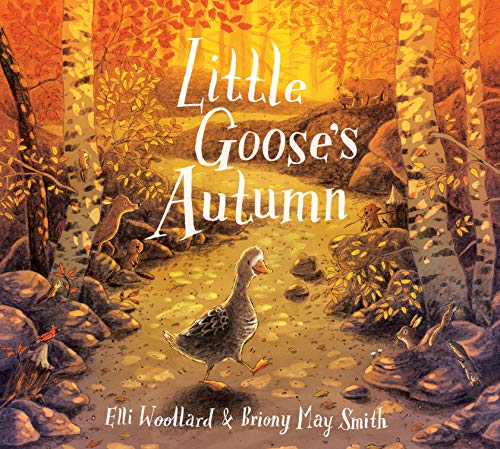 A goose walks a path through a colorful autumn forest scene.