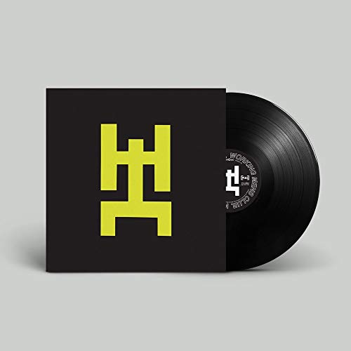Black vinyl record with yellow geometric logo on black sleeve.