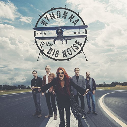 Wynonna & The Big Noise album cover with band on a runway.