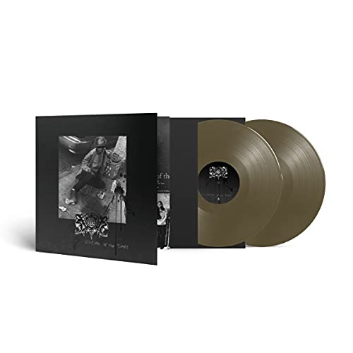 Gold vinyl record and black sleeve with a black and white photograph.