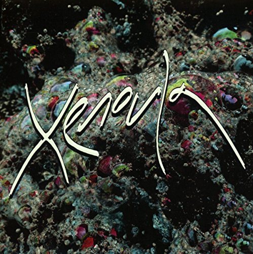 CD cover for Xenoula, featuring textured rock and white script logo.